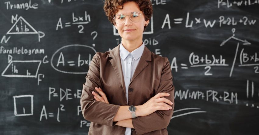 Algebraic Equations - Photo Of Woman Standing In Front Of Blackboard